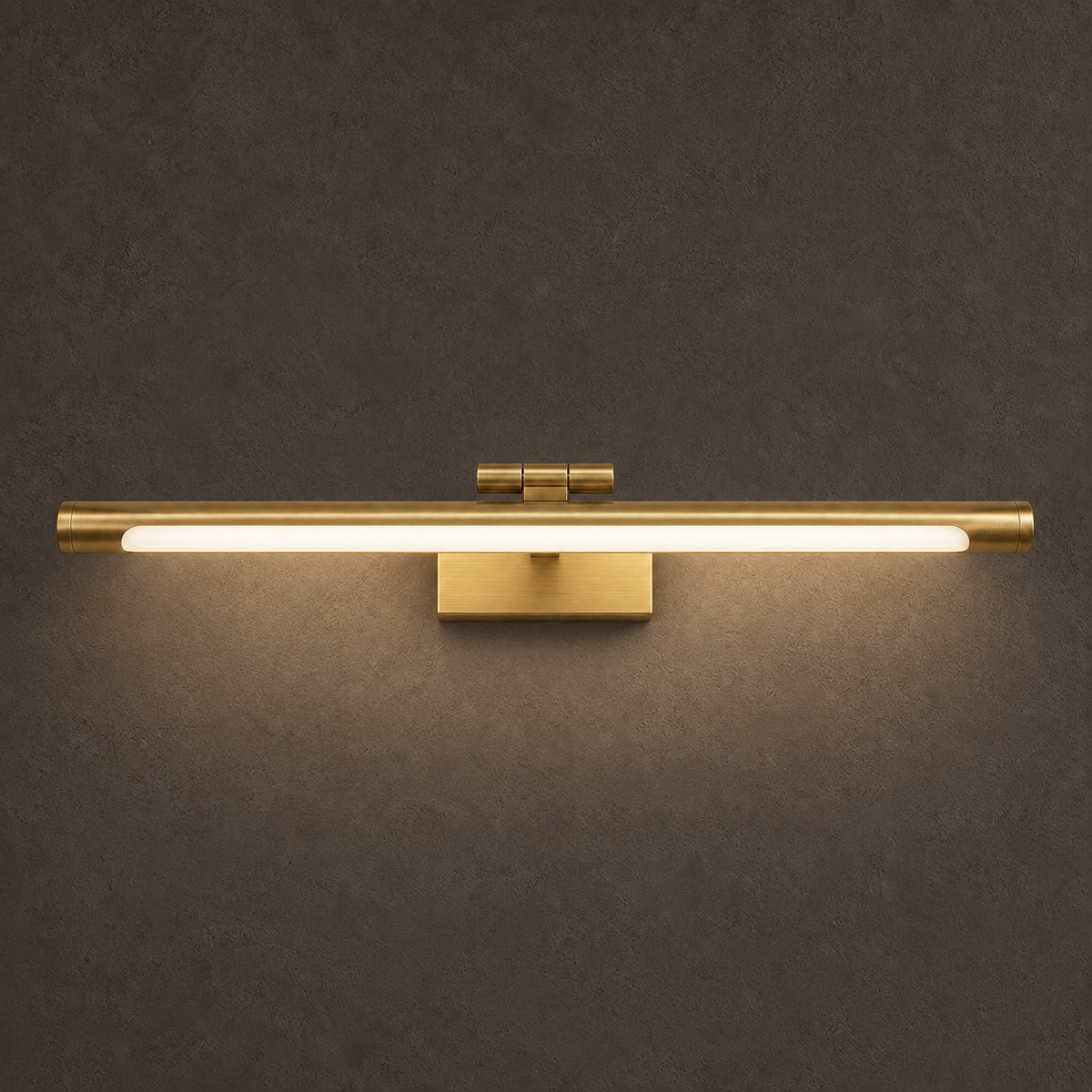 Akia brass wall light, switched on, with a warm glow